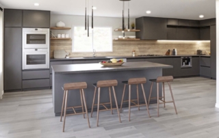 Kitchen Islands with Seating Ideas. Kitchen island that is grey and black with four stools.