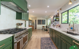 Opening a load bearing wall between the kitchen and living room. Image of kitchen with open layout into other living spaces.